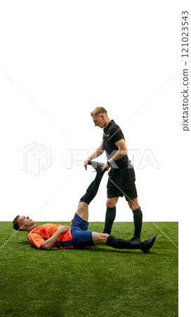 Referee helping man, soccer player lying on floor with injured leg during match, isolated on white background Referee helping man, soccer player lying on floor with injured leg during match, isolated on white background 121023543