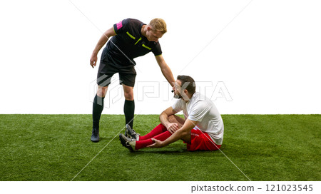 Referee calling for help, standing next to man sitting on floor with injured leg during match, isolated on white background Referee calling for help, standing next to man sitting on floor with injured leg during match, isolated on white background 121023545