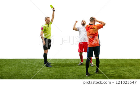Moment of justice. Referee showing yellow card to one of the players broke the rules, isolated on white background Moment of justice. Referee showing yellow card to one of the players broke the rules, isolated on white background 121023547