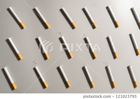 World no tobacco day concept template. Flat layout of cigarettes or tobacco on gray background. World no tobacco day concept template. Flat layout of cigarettes or tobacco on gray background. 121023793