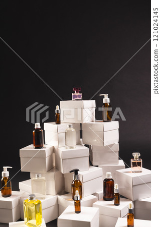 Vertical image of boxes with beauty products and copy space over black background Vertical image of boxes with beauty products and copy space over black background 121024145