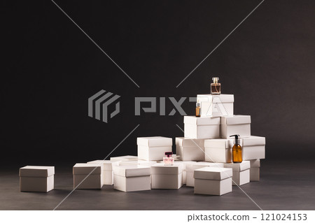 Boxes with beauty products and copy space over black background 121024153