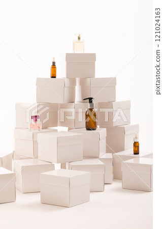 Vertical image of boxes with beauty products and copy space over white background 121024163
