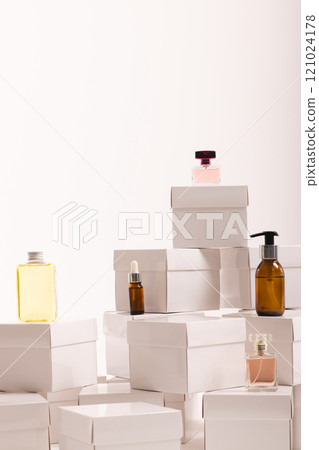 Vertical image of boxes with beauty products and copy space over white background 121024178