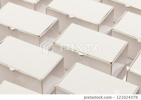 Rows of cardboard gift boxes with copy space over white background 121024378