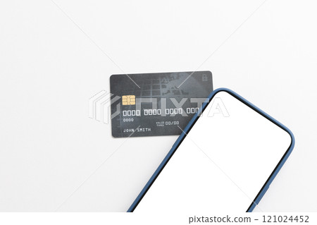 Smartphone with blank screen and credit card on white background Smartphone with blank screen and credit card on white background 121024452