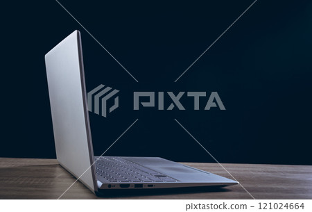 Open laptop with copy space on black background 121024664