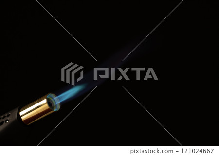 Close up of lit torch light with copy space on black background Close up of lit torch light with copy space on black background 121024667