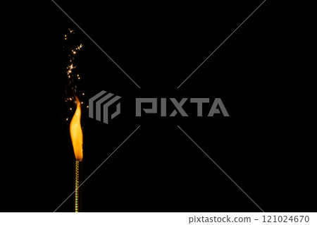 Close up of gas lighter with flames and copy space on black background 121024670