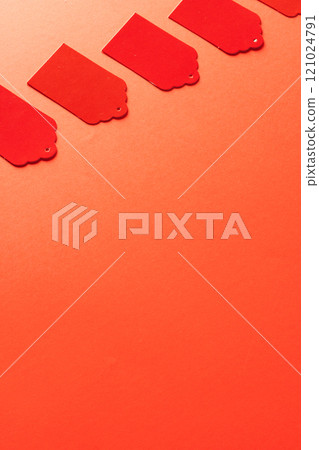 Row of red price tags with copy space on red background 121024791