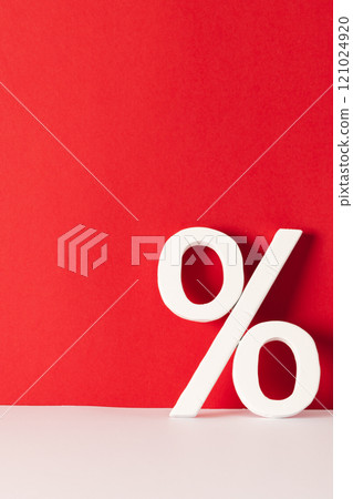 White percent sign with copy space against red background 121024920