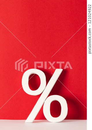White percent sign with copy space against red background 121024922
