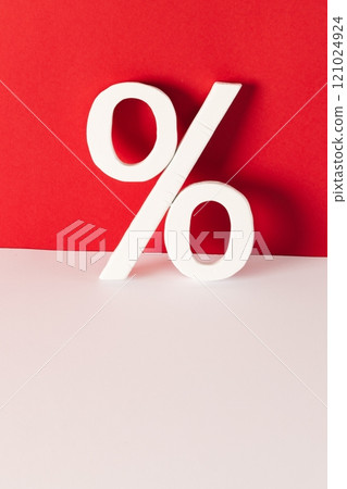 White percent sign with copy space against red background 121024924