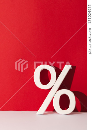 White percent sign with copy space against red background 121024925