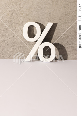 White percent sign with copy space against grey stone wall background White percent sign with copy space against grey stone wall background 121024937