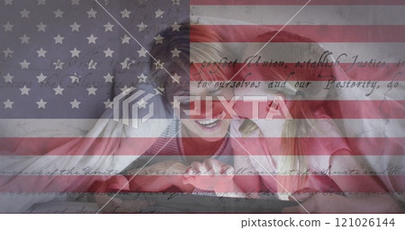 American flag and constitution text against caucasian girl kissing her mother under a blanket 121026144