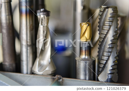 Close-up scene the group of used cutter end mill tools. Close-up scene the group of used cutter end mill tools. 121026379