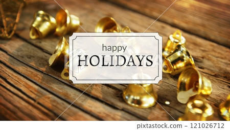 Happy holidays text and Christmas bells Happy holidays text and Christmas bells 121026712