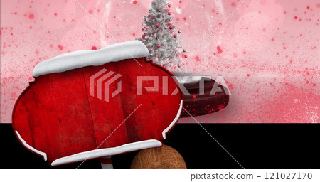 Image of road sign with copy space over snow globe and glowing spots on pink background 121027170