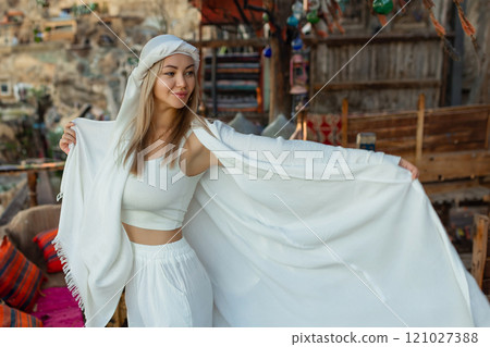 Portrait of a beautiful woman in Arabic clothing in Egypt during sunset. 121027388