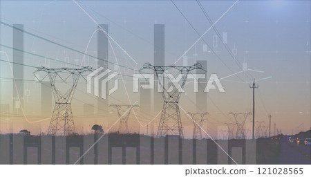 Transmission towers near a highway 4k 121028565