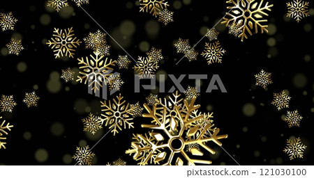 Image of golden snowflakes of various sizes floating against dark background 121030100