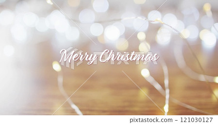 Image of merry christmas text over christmas lights 121030127