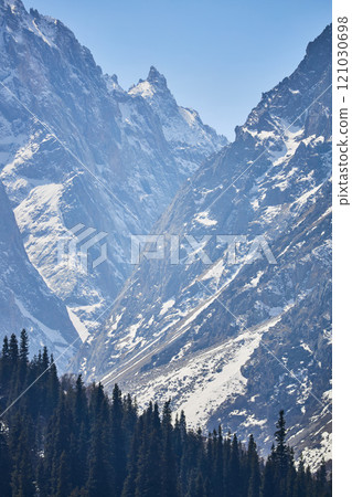 Snowy mountain peaks, rock Snowy mountain peaks, rock 121030698
