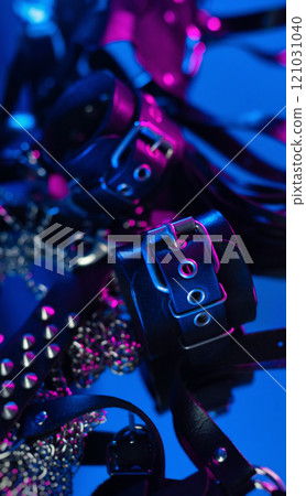 A set of erotic toys for BDSM. Sex slavery game with whip, choker and leather mask and belt for intimate sex games from a sex shop 121031040