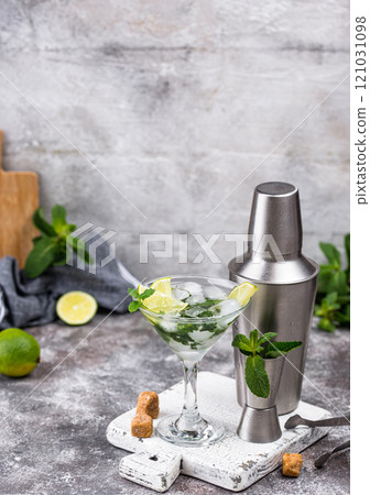 Martini cocktail with lime and mint. Martini cocktail with lime and mint. 121031098