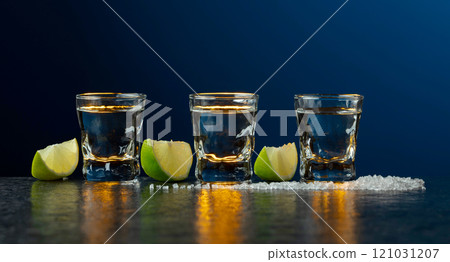 Mexican Tequila with lime and salt on a stone table. Mexican Tequila with lime and salt on a stone table. 121031207