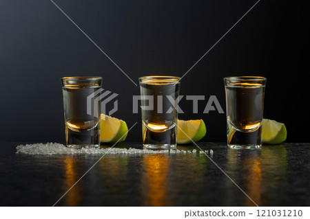 Tequila with lime and salt on a stone table. 121031210