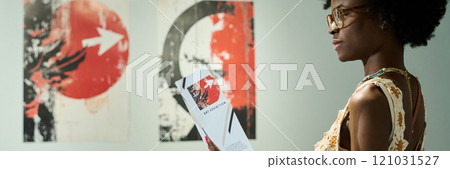 Female visitor of modern art gallery Female visitor of modern art gallery 121031527