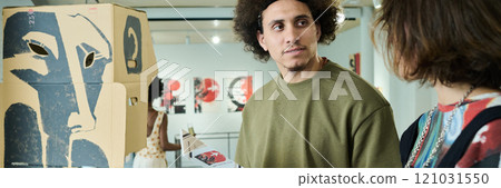 Young male visitor of art gallery Young male visitor of art gallery 121031550