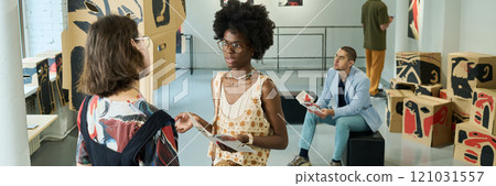 Intercultural visitors of modern gallery 121031557