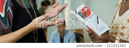 Hands of intercultural gallery visitors Hands of intercultural gallery visitors 121031562
