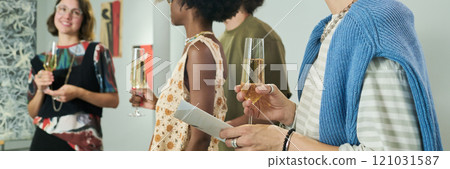 Woman holding flute of champagne Woman holding flute of champagne 121031587