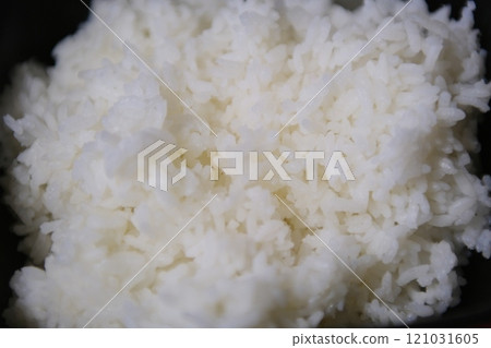Top Table View Of Thai Jasmine Rice in Wooden Bowl, staple food of Thailand and Asia, providing energy Top Table View Of Thai Jasmine Rice in Wooden Bowl, staple food of Thailand and Asia, providing energy 121031605