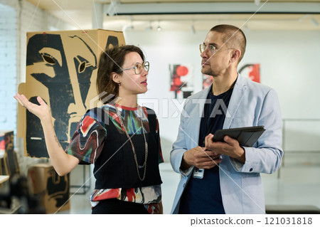 Discussing arrangement of artworks Discussing arrangement of artworks 121031818