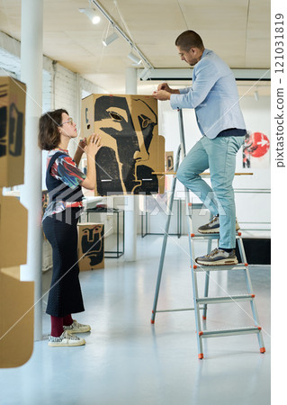 Hanging installation on ceiling in hall 121031819