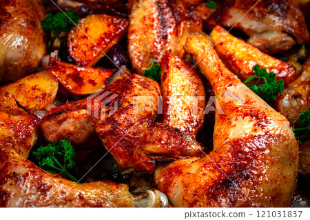 Roast chicken legs with potatoes and onions in the oven, homemade. No people. Roast chicken legs with potatoes and onions in the oven, homemade. No people. 121031837