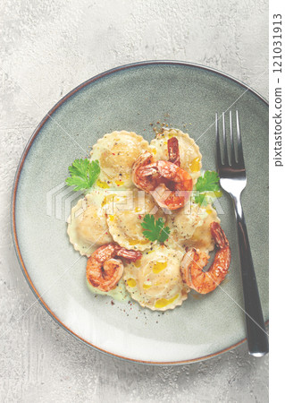 ravioli with shrimp, in cream sauce, with spices and herbs, top view, no people, 121031913