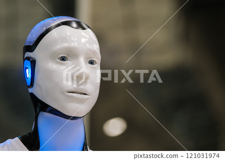 Futuristic robot with illuminated features in a dimly lit background 121031974