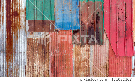 multi-colored roof covered with different old rusty materials of various colors multi-colored roof covered with different old rusty materials of various colors 121032168