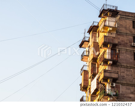 multi-storey residential building lit by sun multi-storey residential building lit by sun 121032437