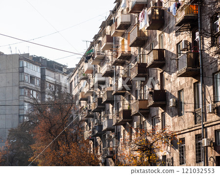 facade of apartment house lit by sunset sun facade of apartment house lit by sunset sun 121032553