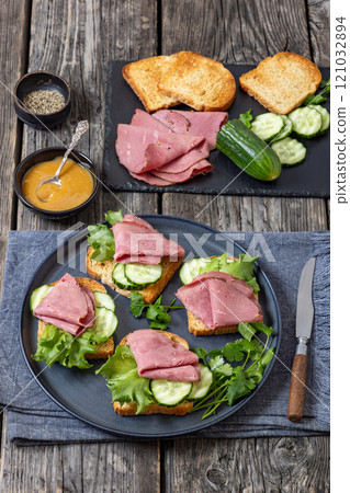 toast with corned beef and veggies, top view 121032894