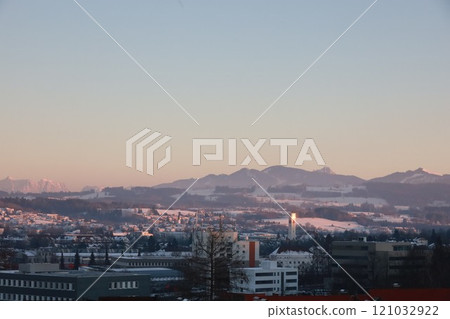 A city skyline with a mountain in the background A city skyline with a mountain in the background 121032922
