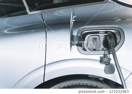 Charging an electric car. Modern electric car 121032963