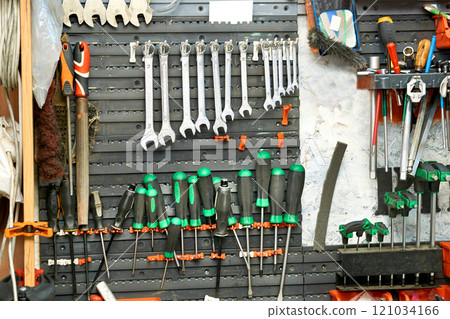 Set of screwdrivers,spanners on a rack in a repair shop,work place Set of screwdrivers,spanners on a rack in a repair shop,work place 121034166